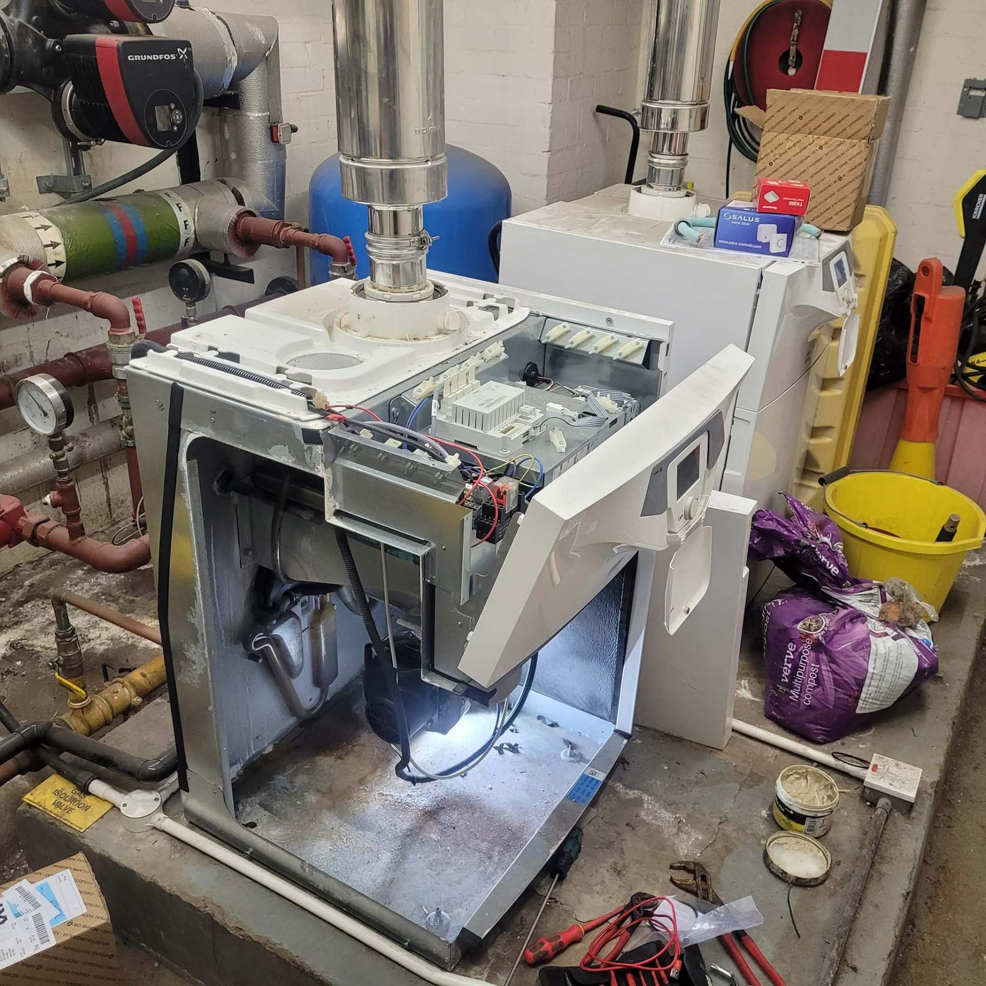 Commercial boiler control panel and wiring during a plant room service