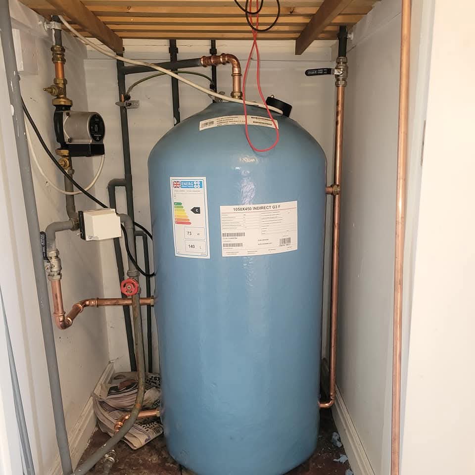 Large pressurised hot water cylinder installed for a high-demand household