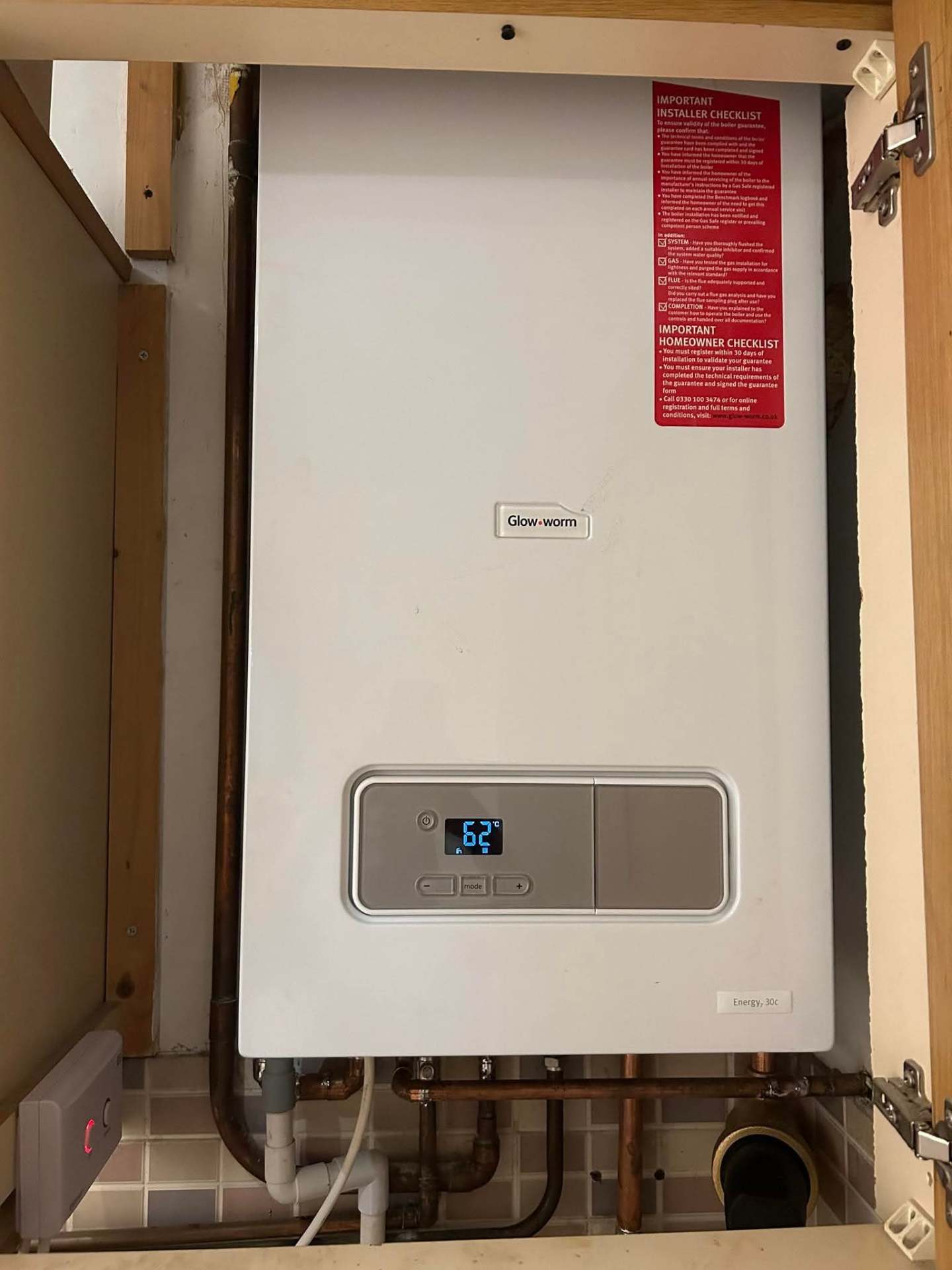 New Glow-worm combi boiler installed in a domestic utility area