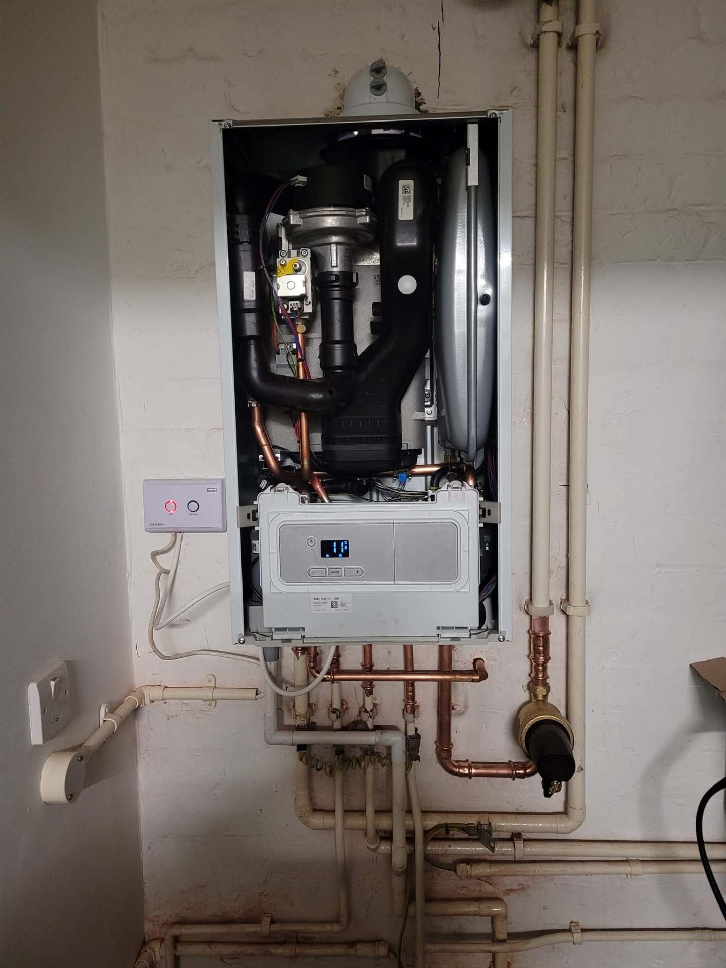 Combi boiler with front casing removed for full service and parts inspection